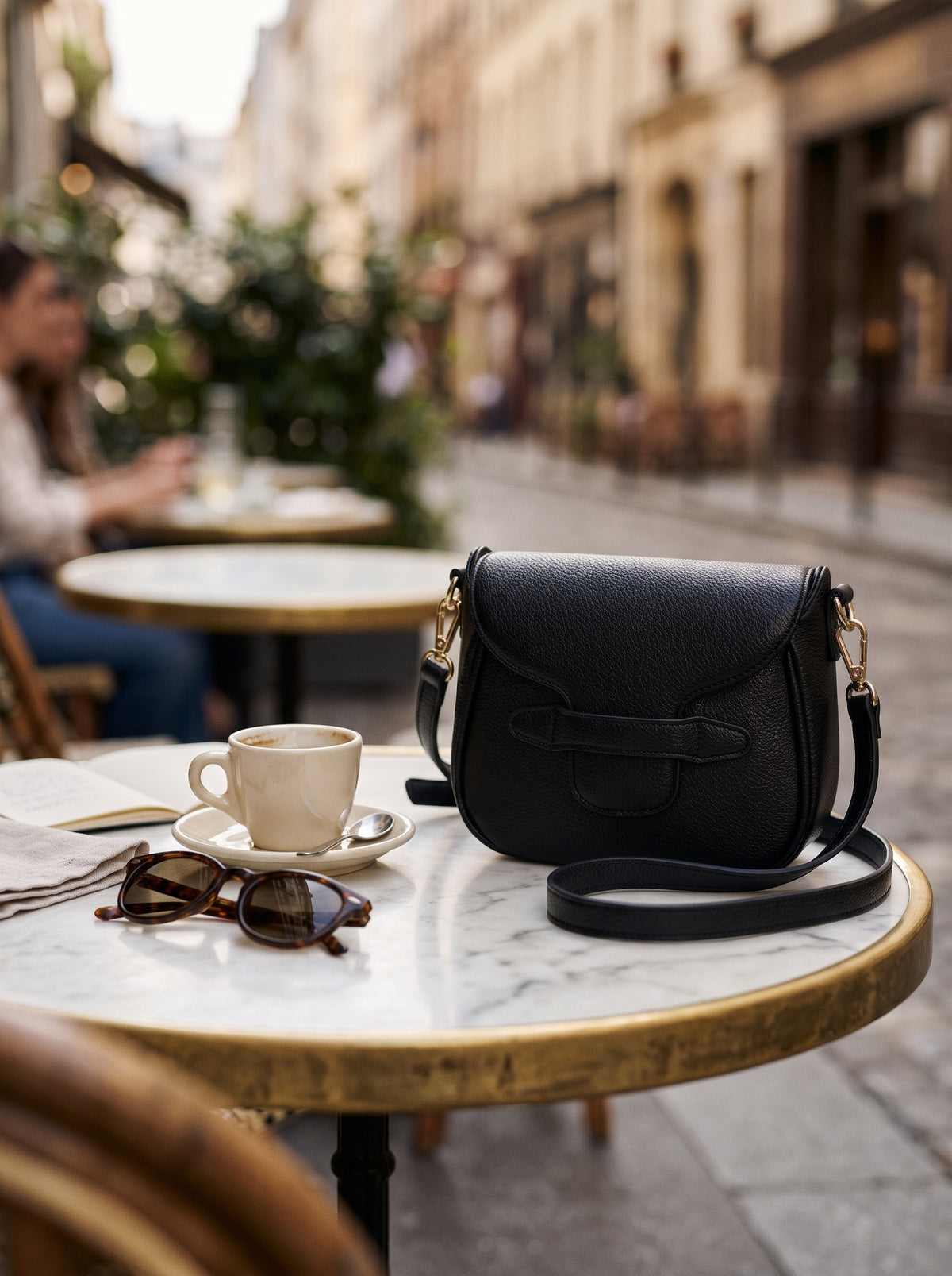 Crossbody Bag — Bistro Table Lifestyle | Generated by Modelize